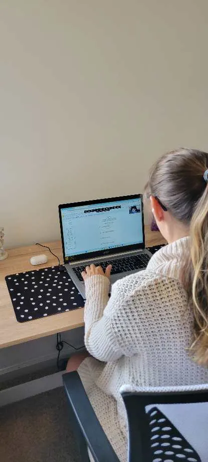 Erin Johnson working at a laptop during an online lesson